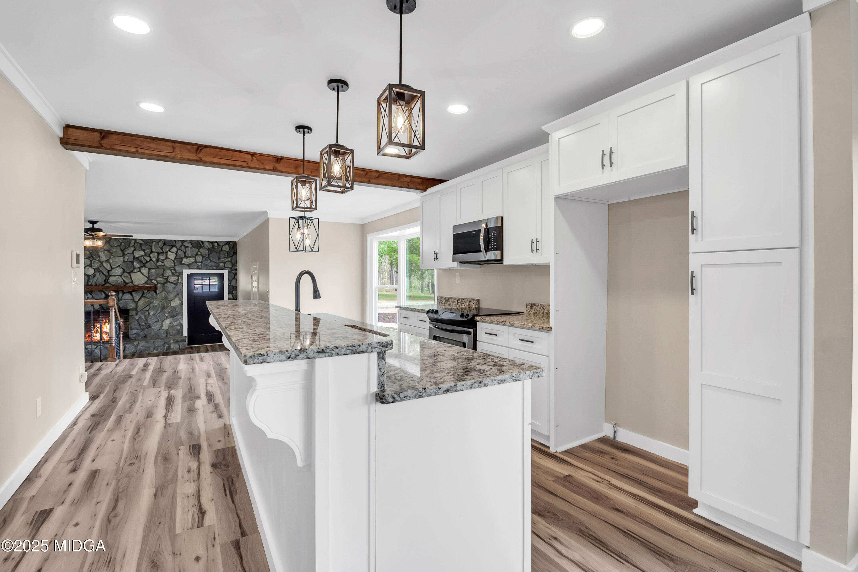 8738 Highway 87 Juliette, GA 31046 - Photo 16 of 36 a view of a kitchen with microwave and cabinets