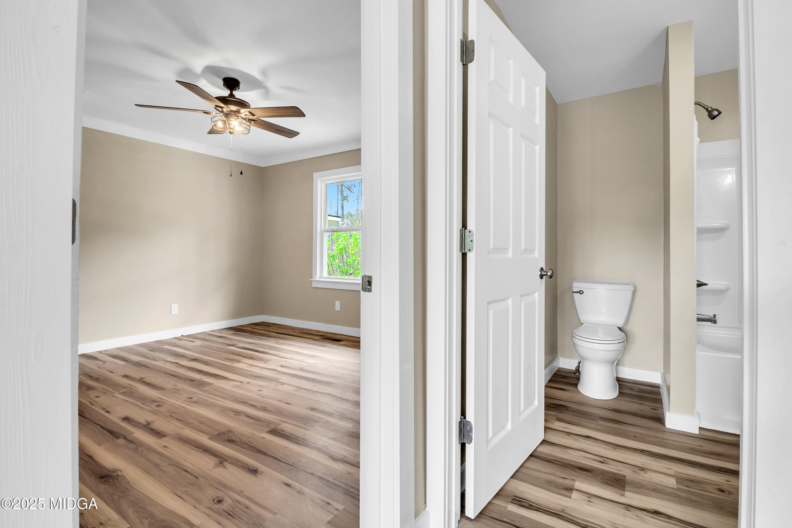 8738 Highway 87 Juliette, GA 31046 - Photo 19 of 36 a view of a hallway with wooden floor and a bathroom