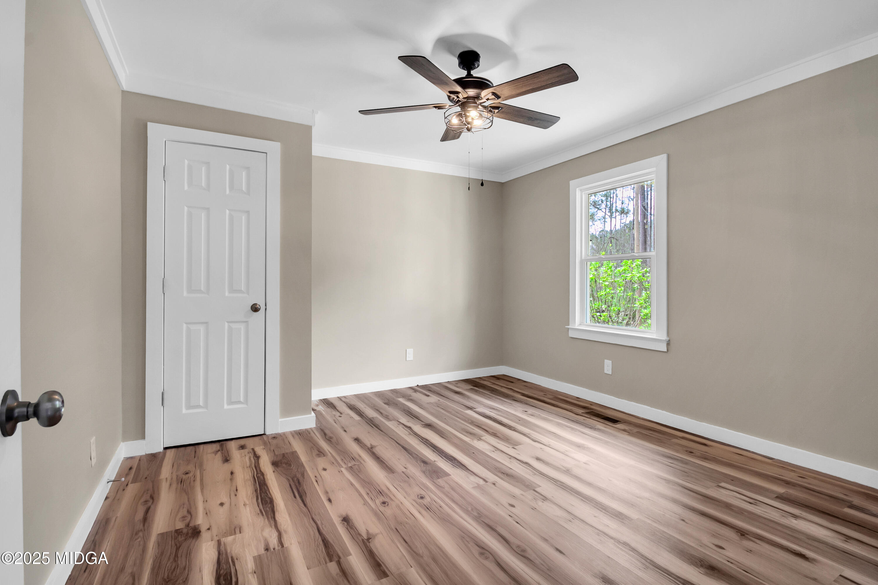 8738 Highway 87 Juliette, GA 31046 - Photo 21 of 36 wooden floor in an empty room with a window