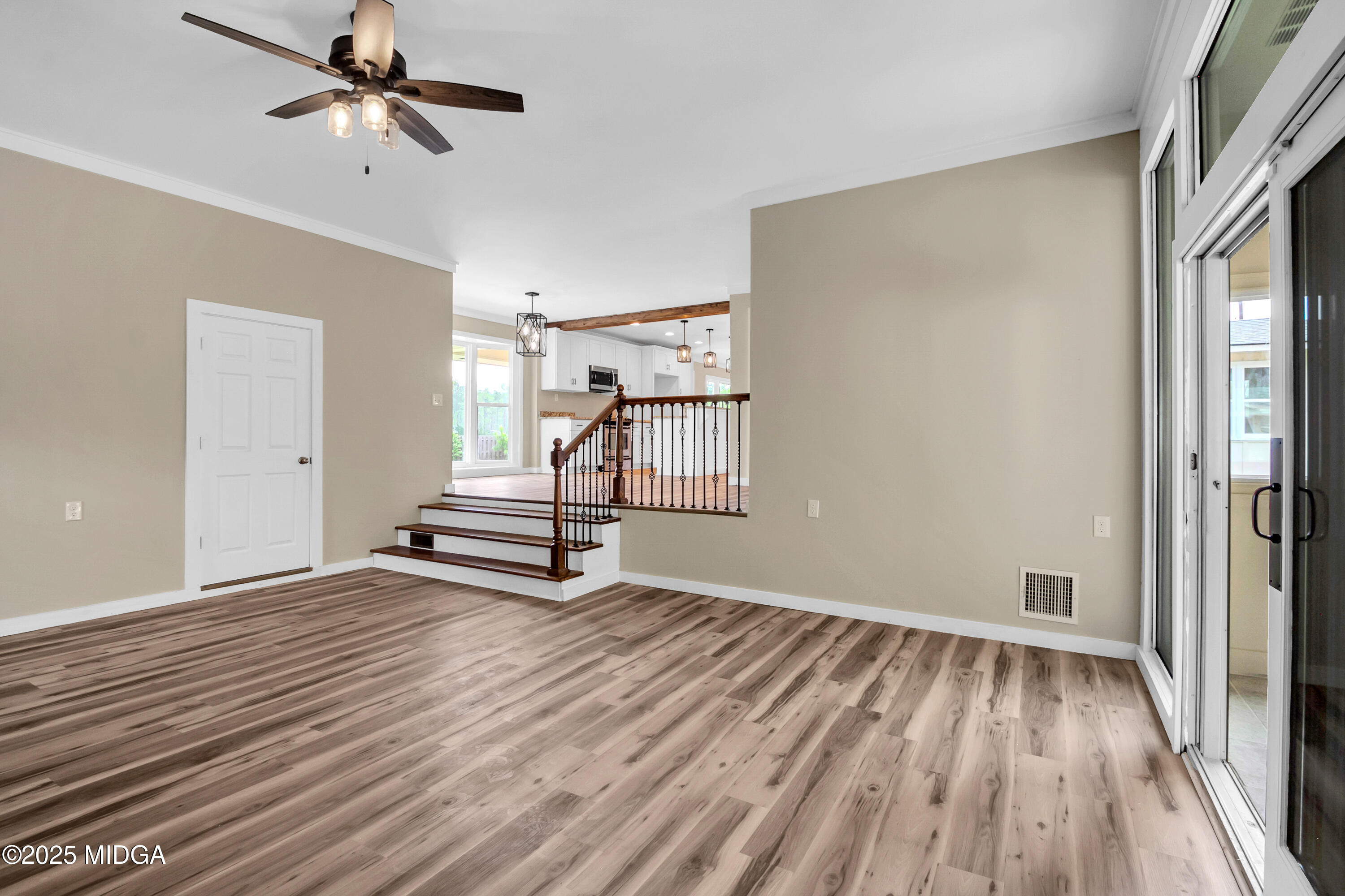 8738 Highway 87 Juliette, GA 31046 - Photo 25 of 36 a view of an empty room with wooden floor and a window