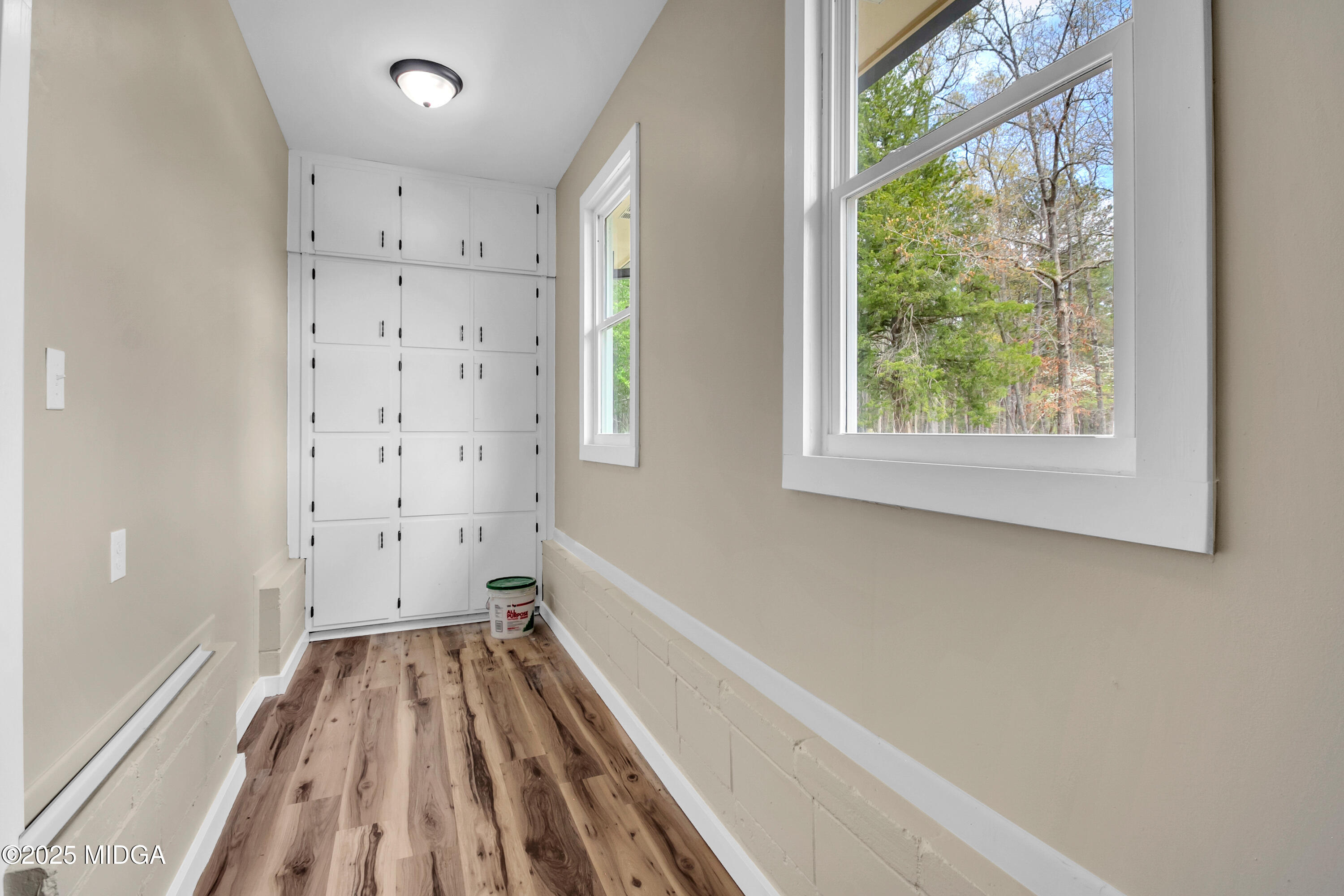 8738 Highway 87 Juliette, GA 31046 - Photo 26 of 36 a view of a hallway with wooden floor and a window