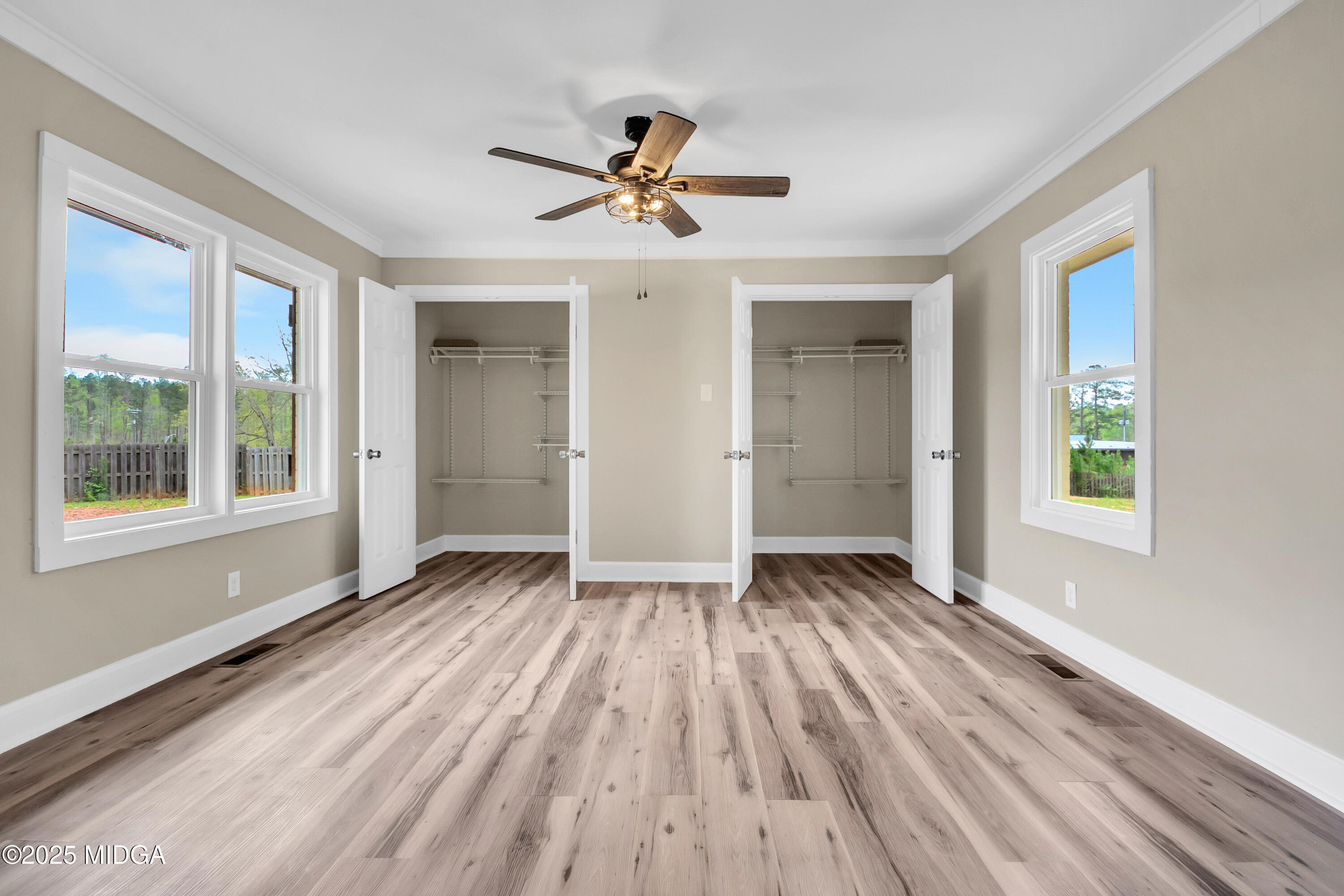 8738 Highway 87 Juliette, GA 31046 - Photo 34 of 36 a view of empty room with wooden floor and fan