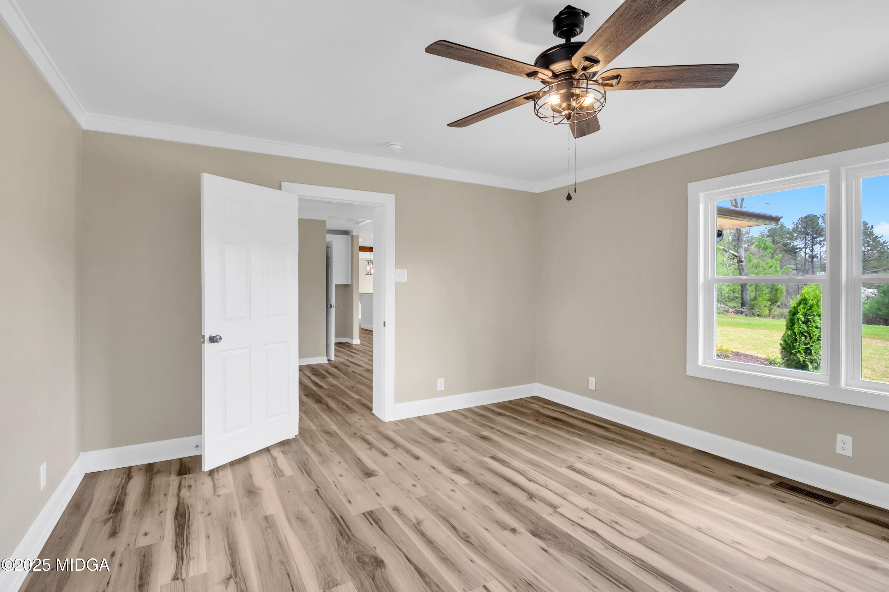 8738 Highway 87 Juliette, GA 31046 - Photo 36 of 36 wooden floor in an empty room with a window