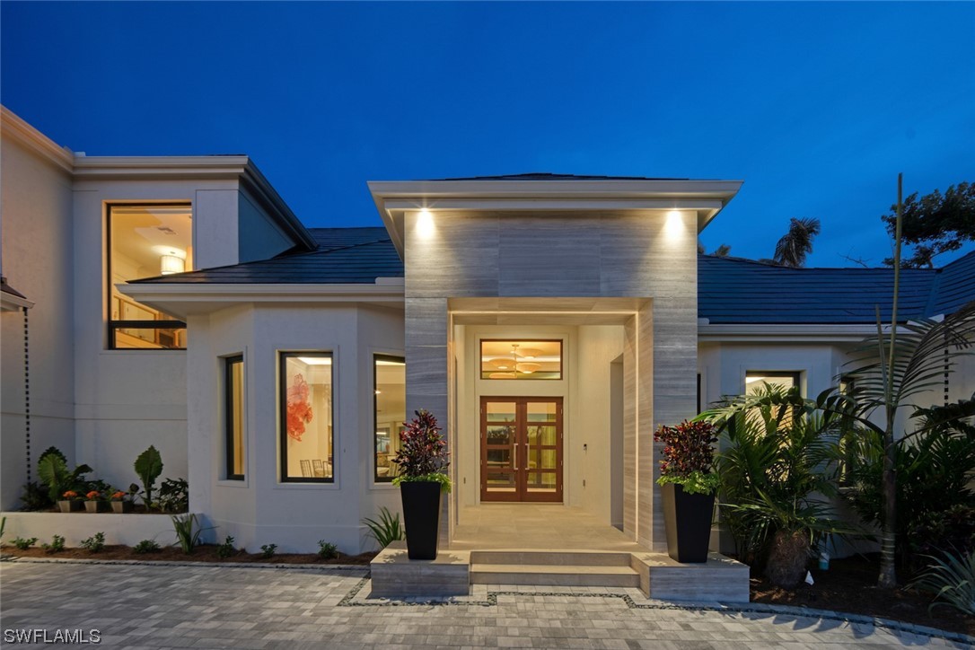 2564 Wulfert Road Sanibel, FL 33957 - Photo 3 of 50 a front view of a house with garden