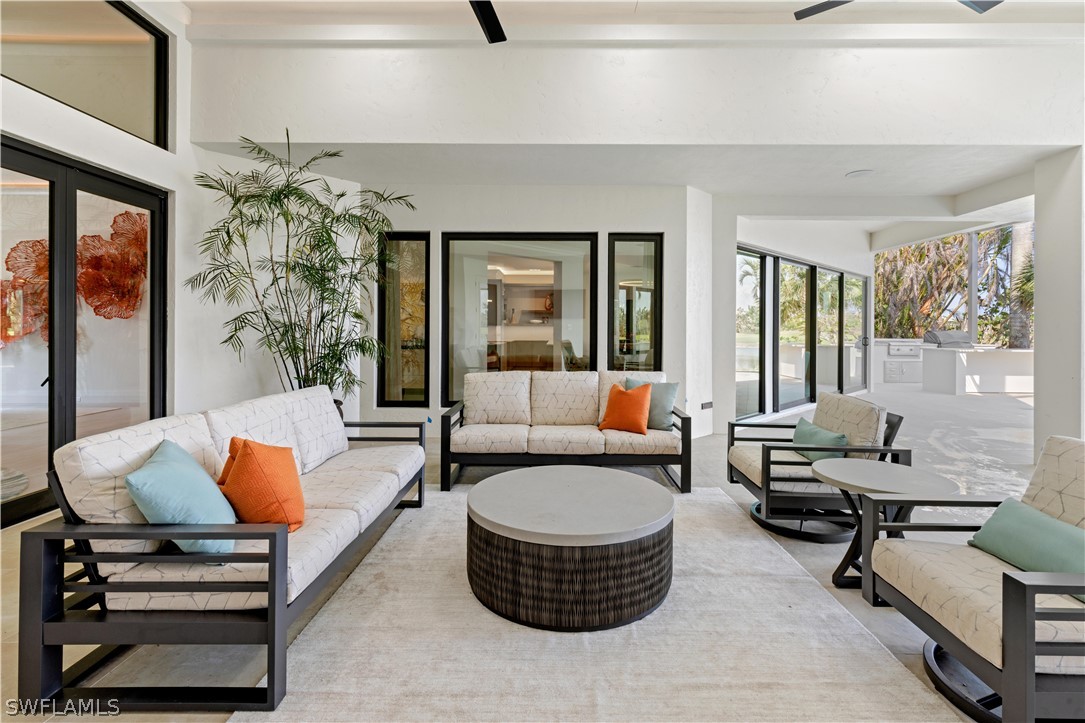 2564 Wulfert Road Sanibel, FL 33957 - Photo 33 of 50 a living room with furniture and a potted plant
