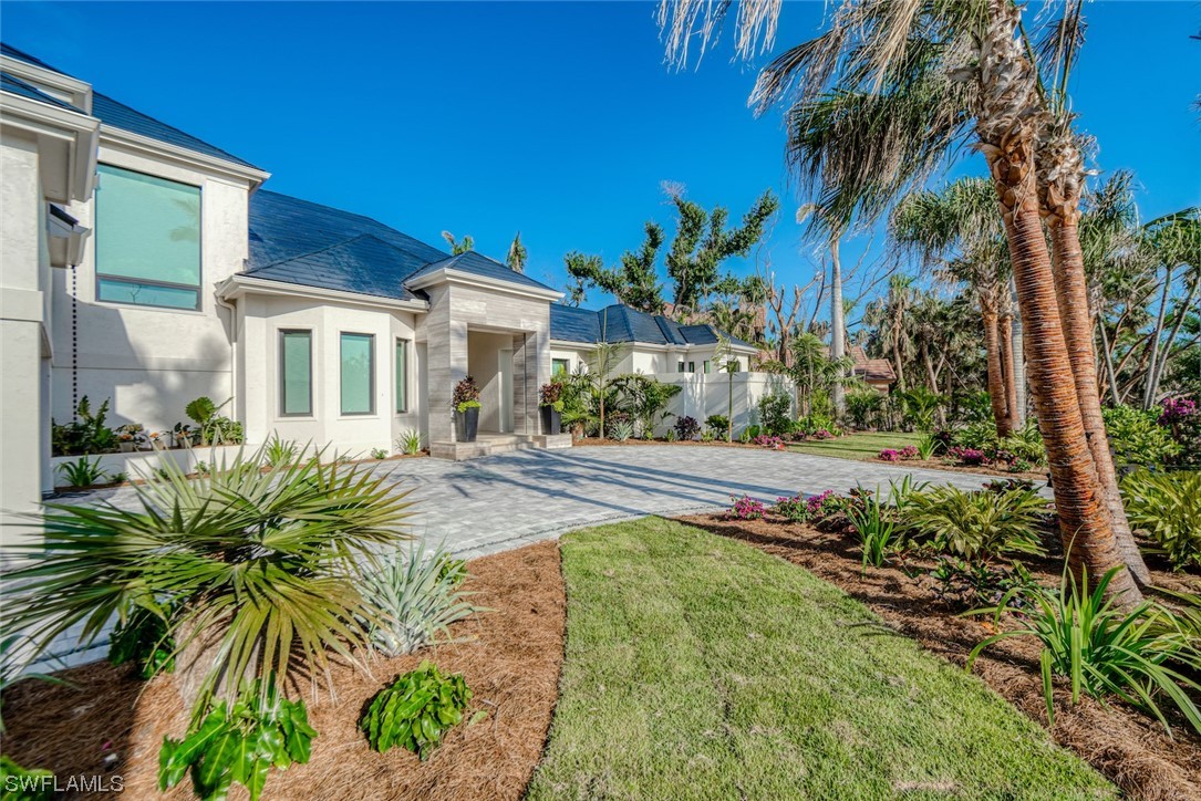 2564 Wulfert Road Sanibel, FL 33957 - Photo 45 of 50 a front view of a house with a yard