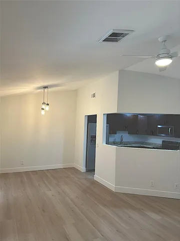 a view of a refrigerator in a kitchen
