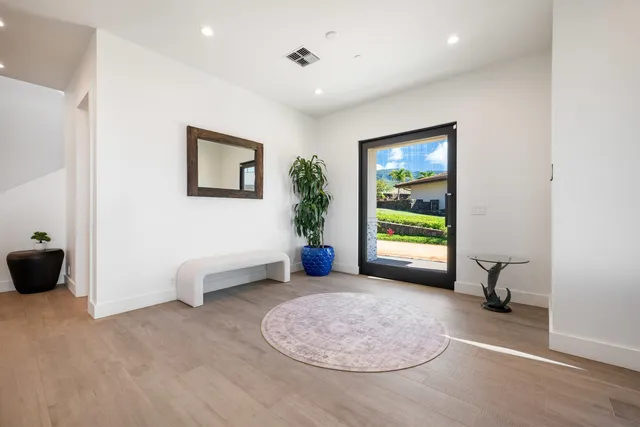 a view of a livingroom with furniture and a window