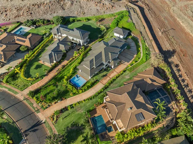 an aerial view of a house with a garden