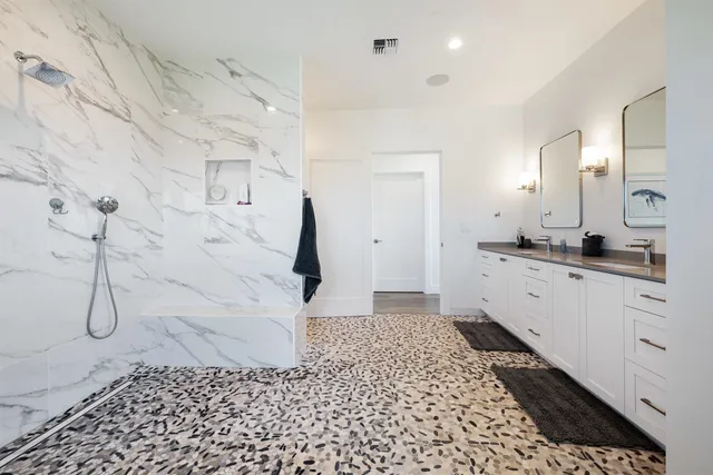 a bathroom with a sink and a shower