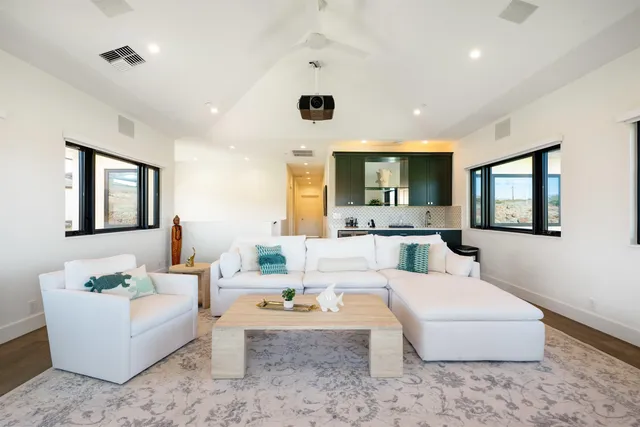 a bedroom with a bed and a couch