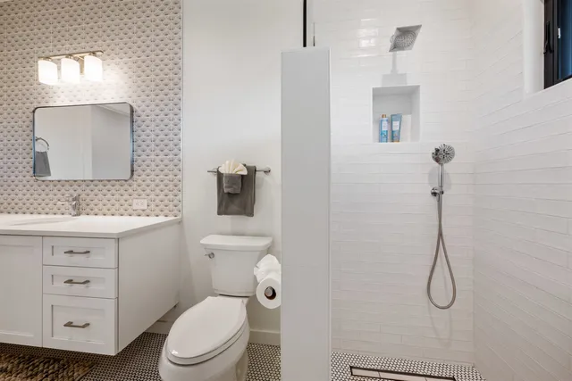 a bedroom with a bed and a potted plant