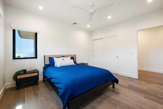 a kitchen with granite countertop white cabinets and sink