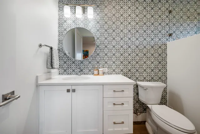 a view of front door with wooden cabinets