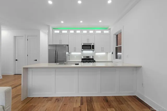 a view of kitchen with wooden floor
