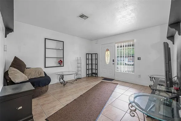 a view of a livingroom with furniture and a flat screen tv