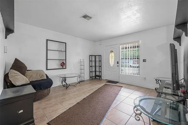 a view of a livingroom with furniture and a flat screen tv