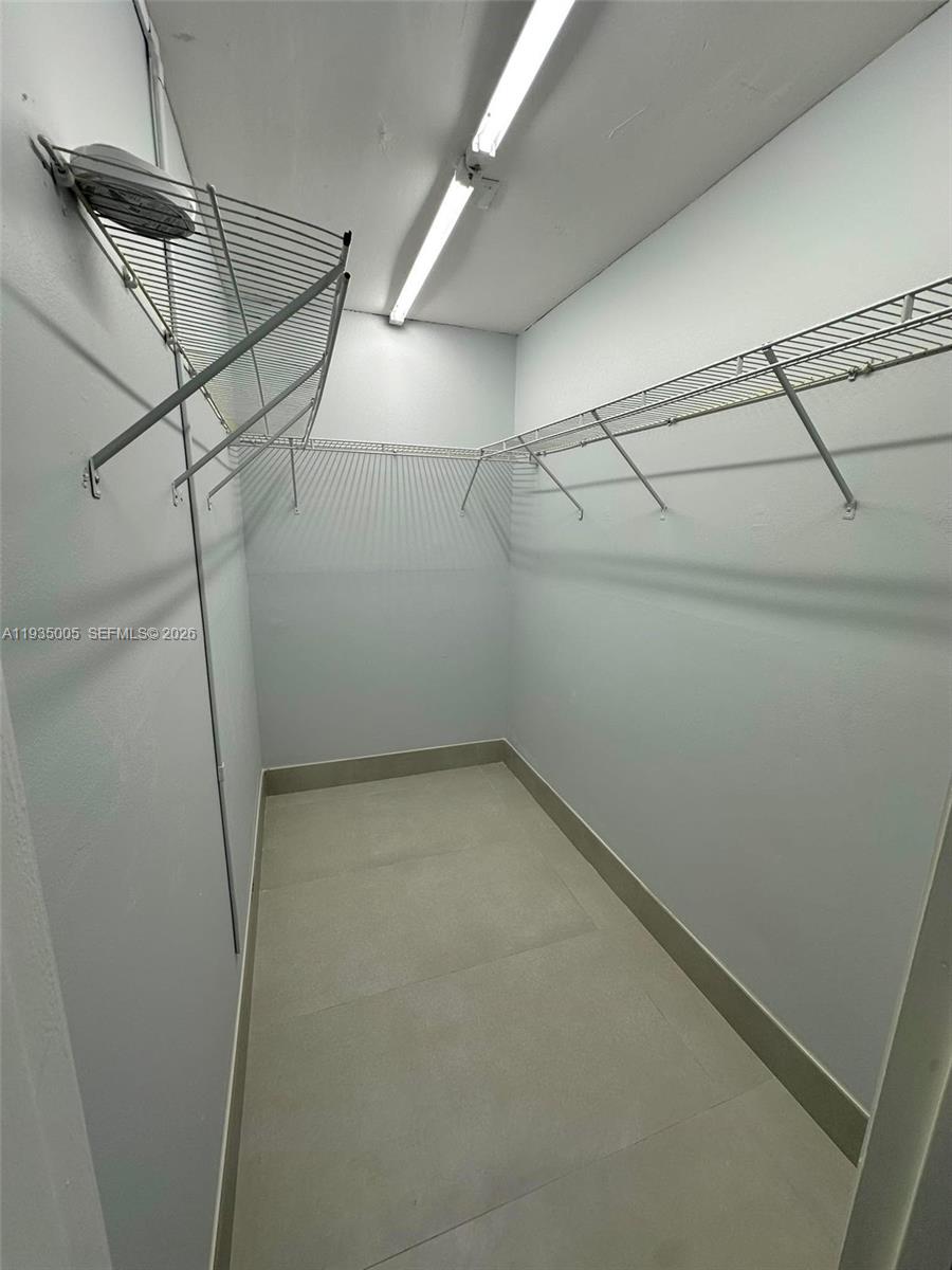9440 Southwest 8th Street, Unit 402 Boca Raton, FL 33428 - Photo 22 of 45 a view of a room with racks on the wall