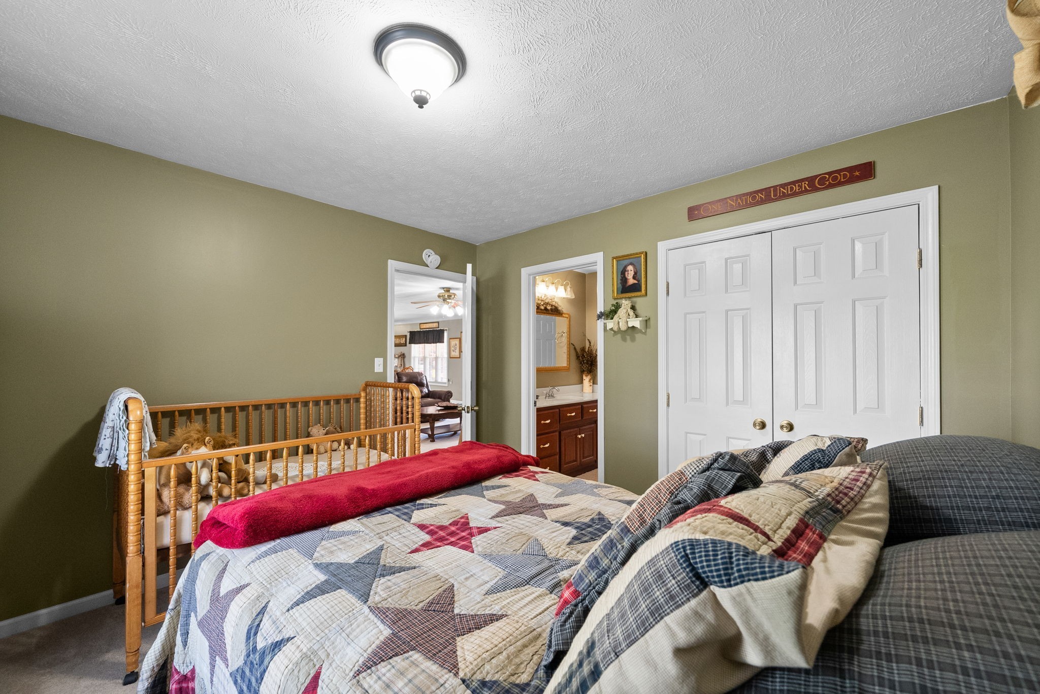 286 Tower Street Guthrie, KY 42234 - Photo 25 of 48 a bed sitting in a bedroom next to a window