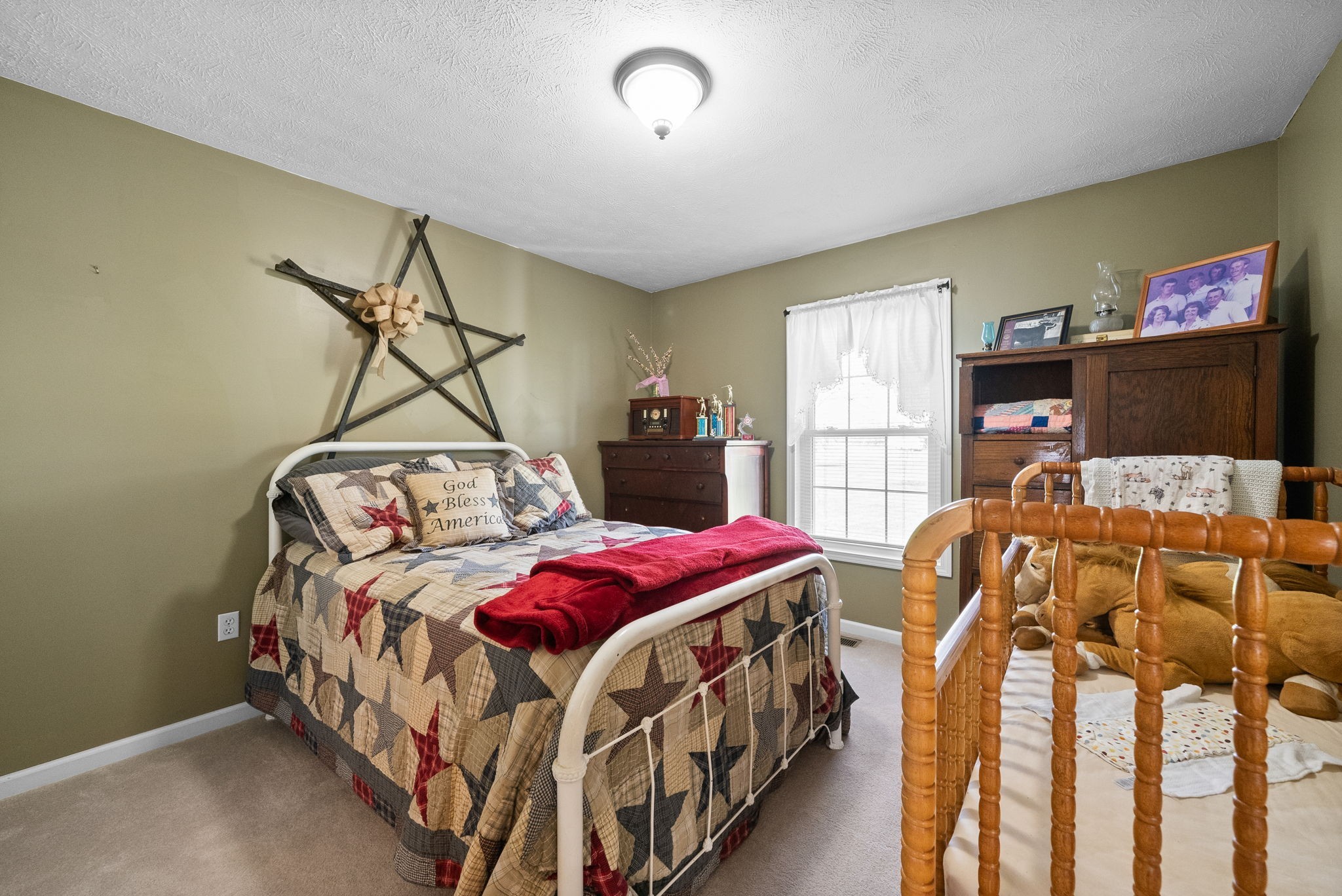 286 Tower Street Guthrie, KY 42234 - Photo 26 of 48 a bedroom with two beds and a chandelier