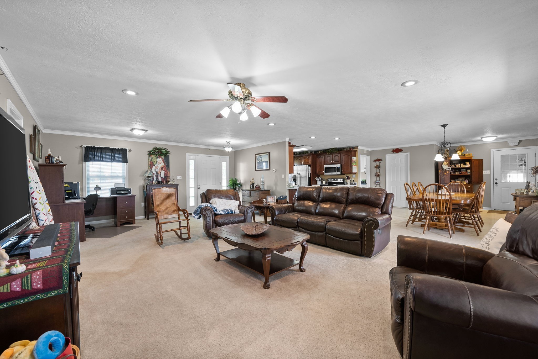 286 Tower Street Guthrie, KY 42234 - Photo 10 of 48 a living room with furniture and a chandelier