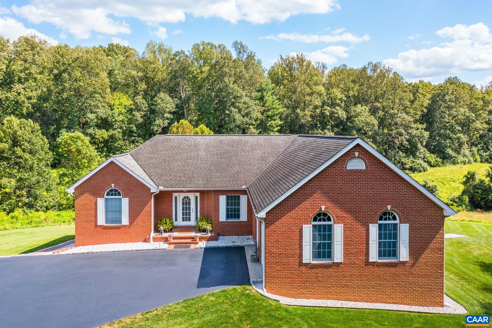 a view of house and outdoor space with yard