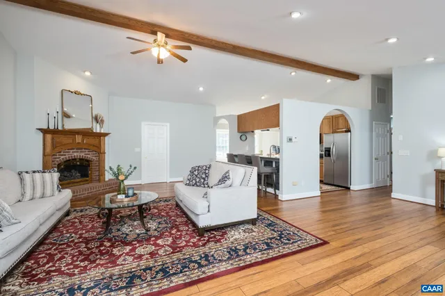 a living room with furniture or couch and a fireplace