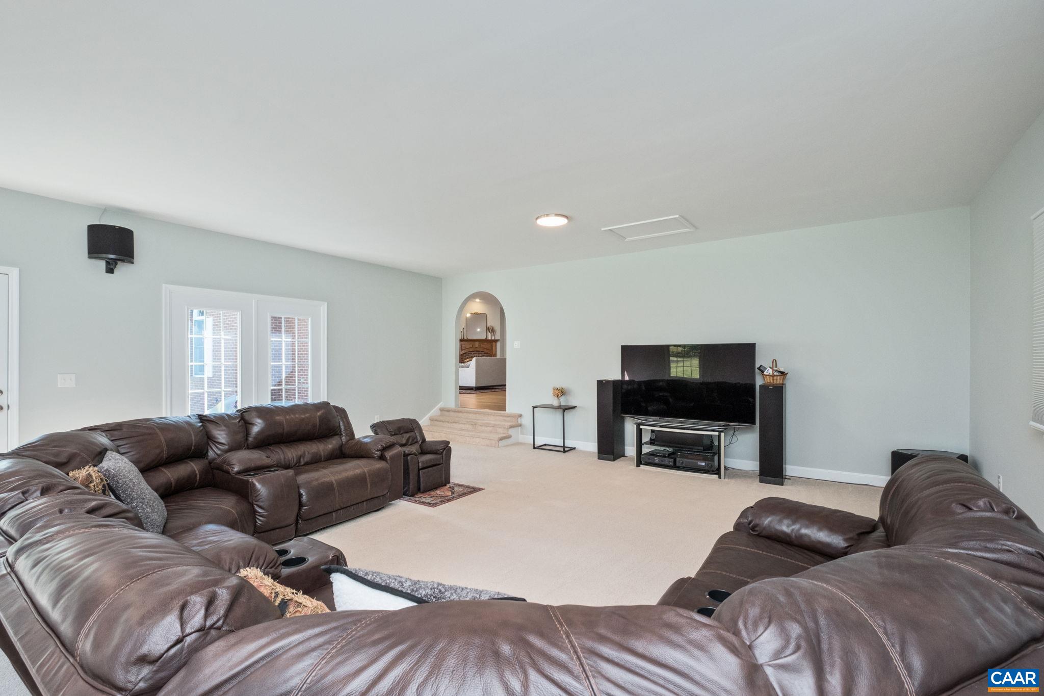 105 Squirrel Path Stanardsville, VA 22973 - Photo 22 of 67 a living room with furniture and a flat screen tv
