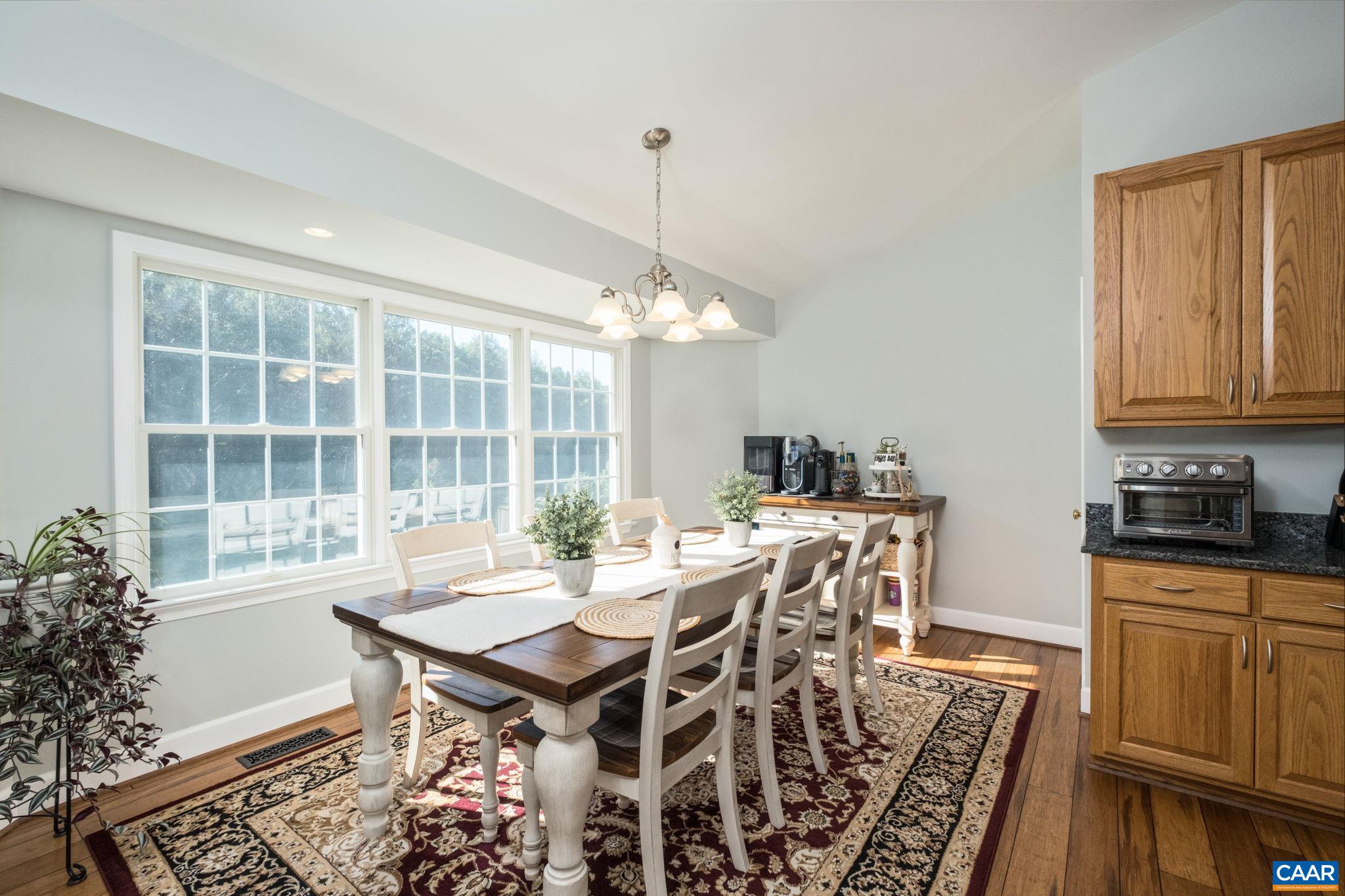 105 Squirrel Path Stanardsville, VA 22973 - Photo 27 of 67 a view of a dining room with furniture window and wooden floor