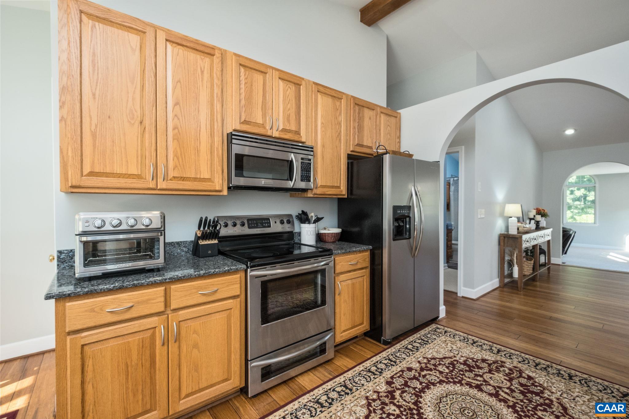 105 Squirrel Path Stanardsville, VA 22973 - Photo 28 of 67 a kitchen with stainless steel appliances granite countertop a refrigerator stove top oven and sink