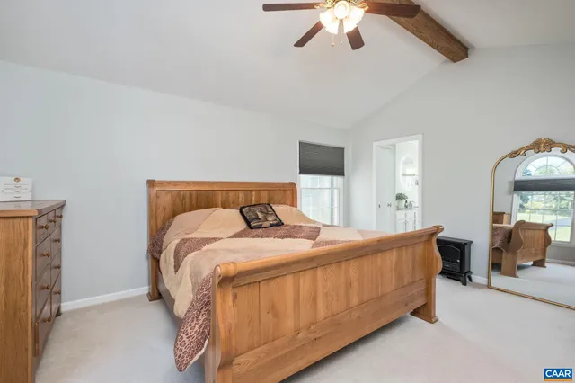 a living room with furniture rug and wooden floor