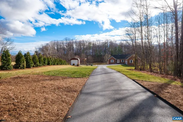 a view of a house with a big yard