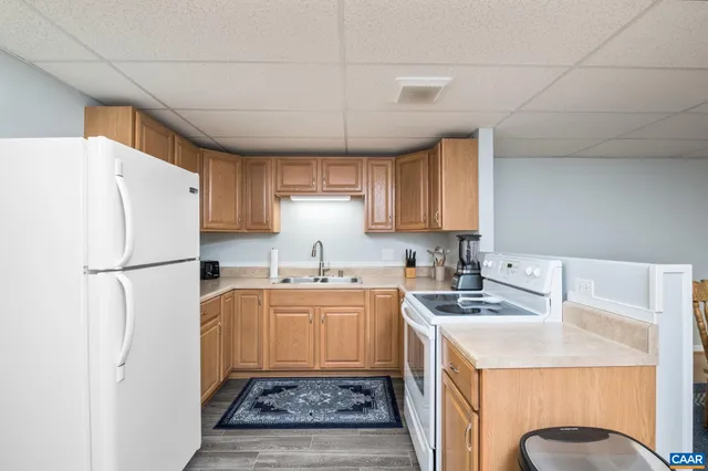 a view of a lush green hillside and houses