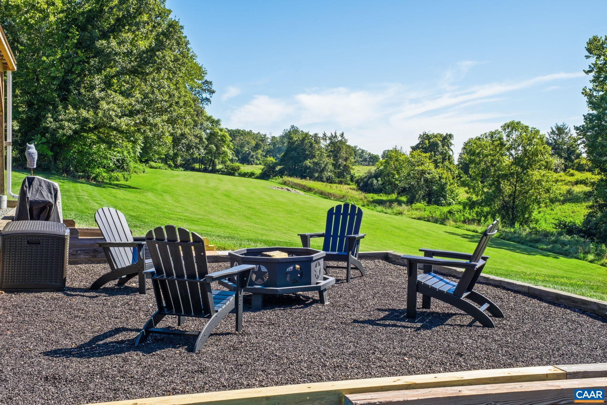 105 Squirrel Path Stanardsville, VA 22973 - Photo 60 of 67 a view of a chairs and table in the garden