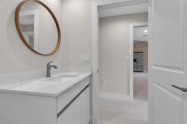a bathroom with a sink and a mirror