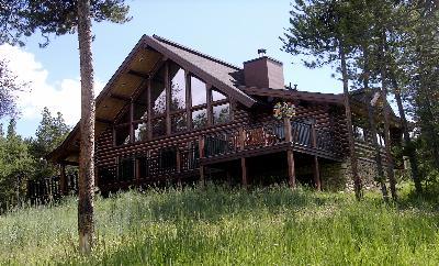 86 Alpine Road Fraser, CO 80442 - Photo 1 of 1 a view of a house with a small yard
