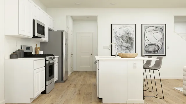 a kitchen with stainless steel appliances a refrigerator and a stove top oven