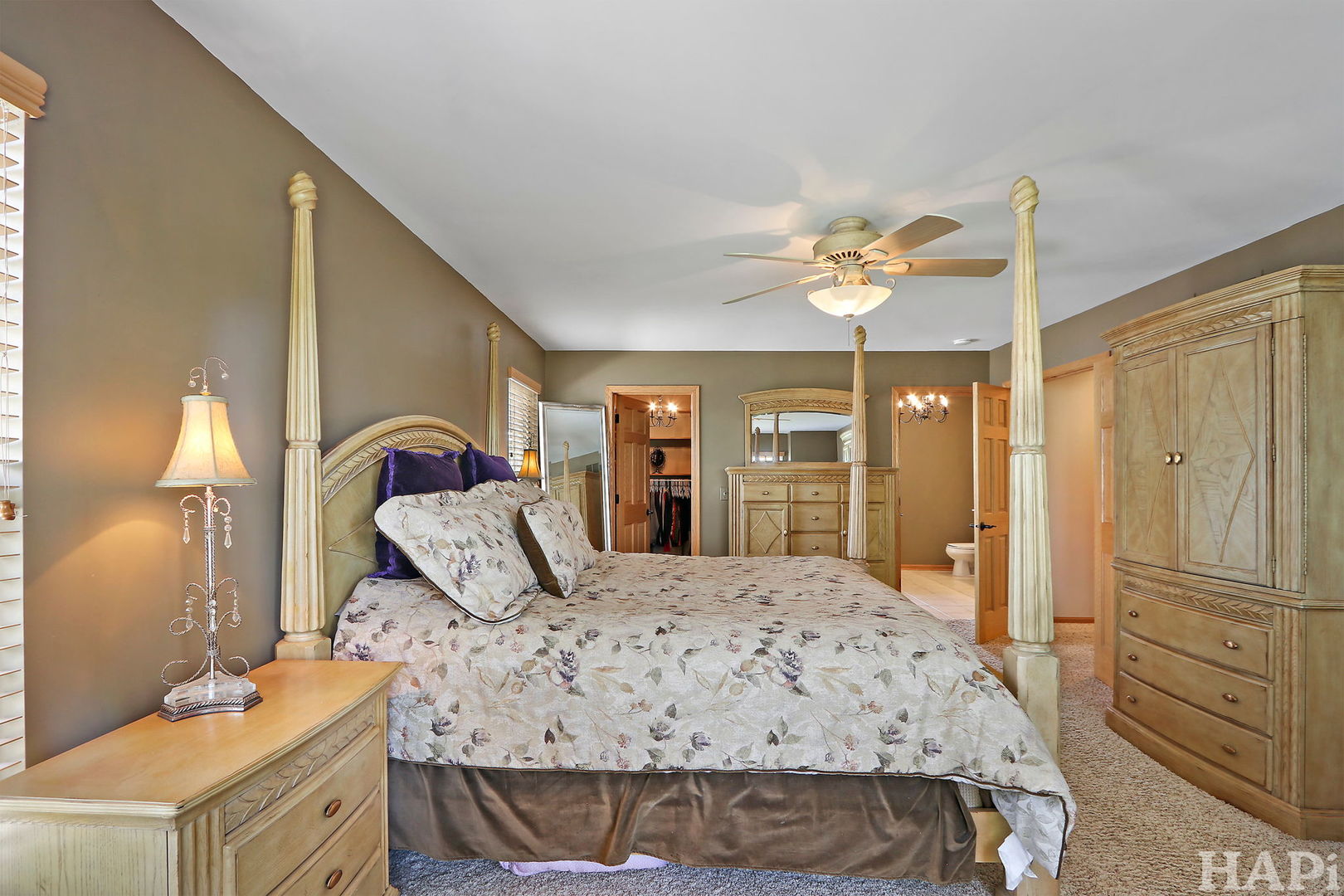 261 Hampton Road Sugar Grove, IL 60554 - Photo 17 of 35 a bedroom with a bed and a chandelier