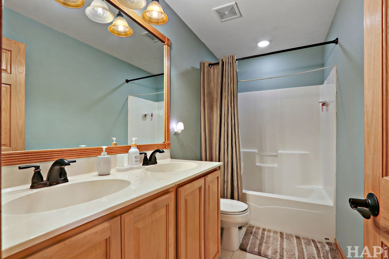 261 Hampton Road Sugar Grove, IL 60554 - Photo 23 of 35 a bathroom with a sink and a mirror