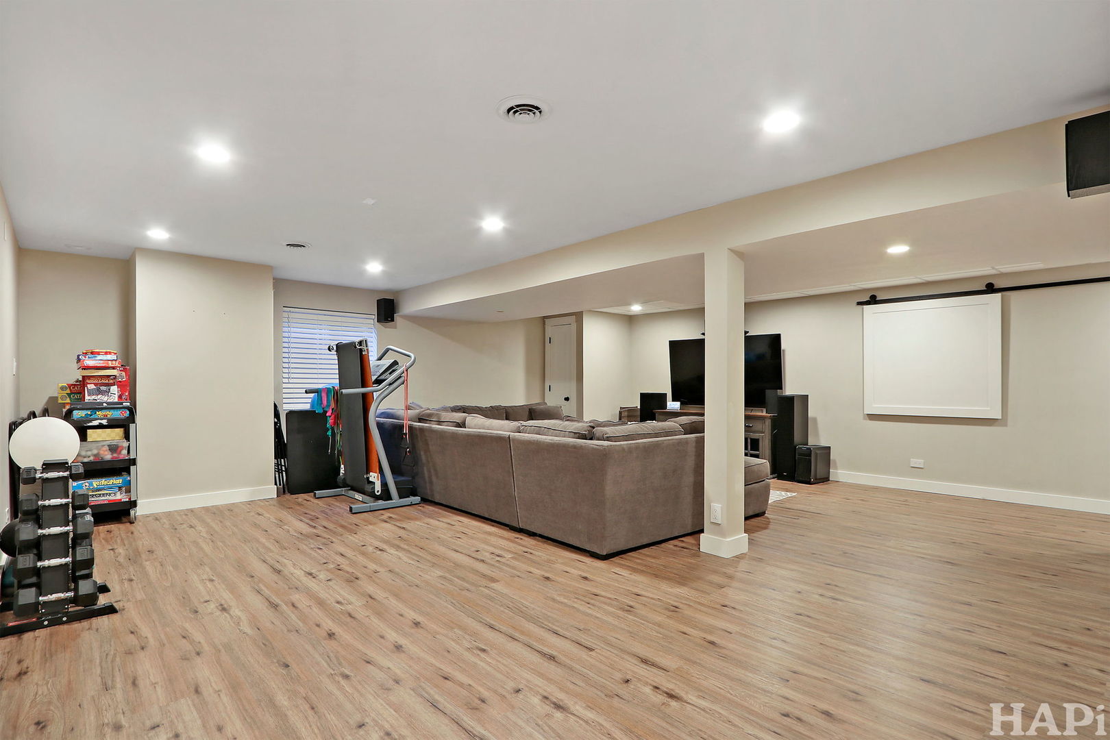 261 Hampton Road Sugar Grove, IL 60554 - Photo 24 of 35 a large room with wooden floor and furniture