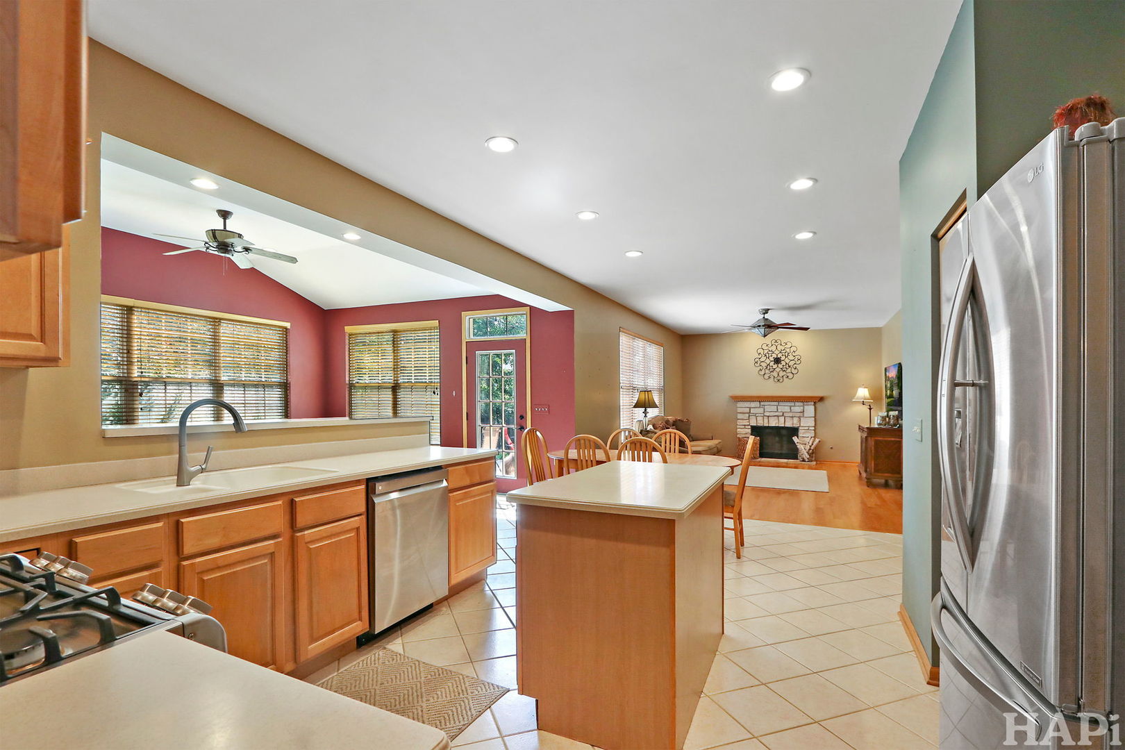261 Hampton Road Sugar Grove, IL 60554 - Photo 5 of 35 a kitchen with stainless steel appliances granite countertop a sink and a refrigerator