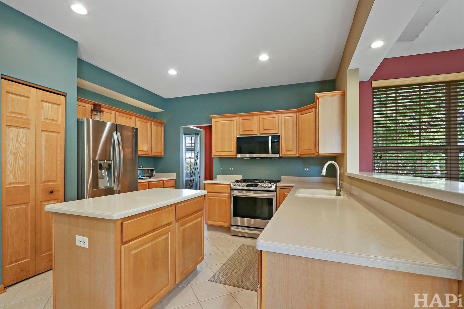 261 Hampton Road Sugar Grove, IL 60554 - Photo 7 of 35 a kitchen with stainless steel appliances granite countertop a sink and a refrigerator