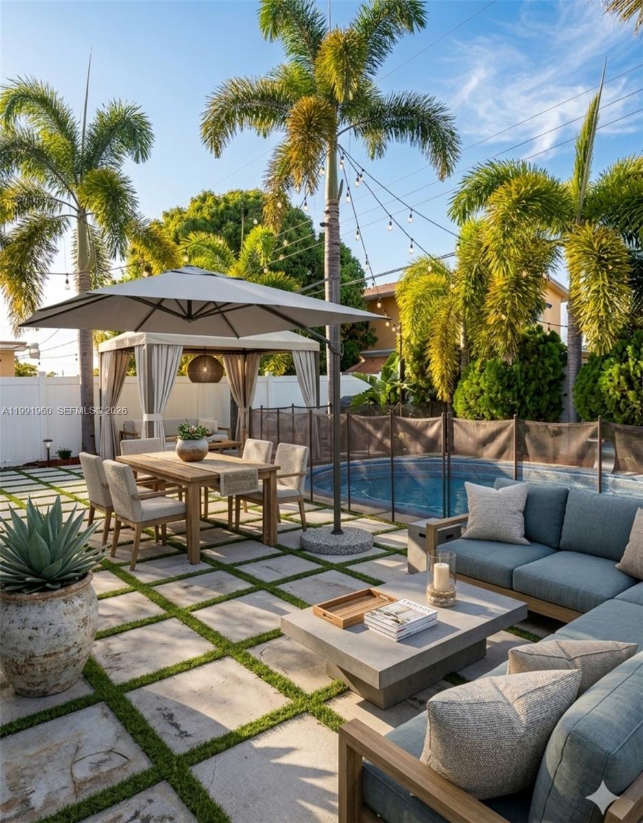 a view of a patio with couches and a fire pit