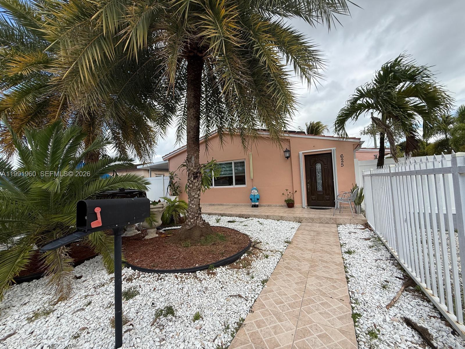 625 East 8th Lane Hialeah, FL 33010 - Photo 12 of 46 a backyard of a house with seating space