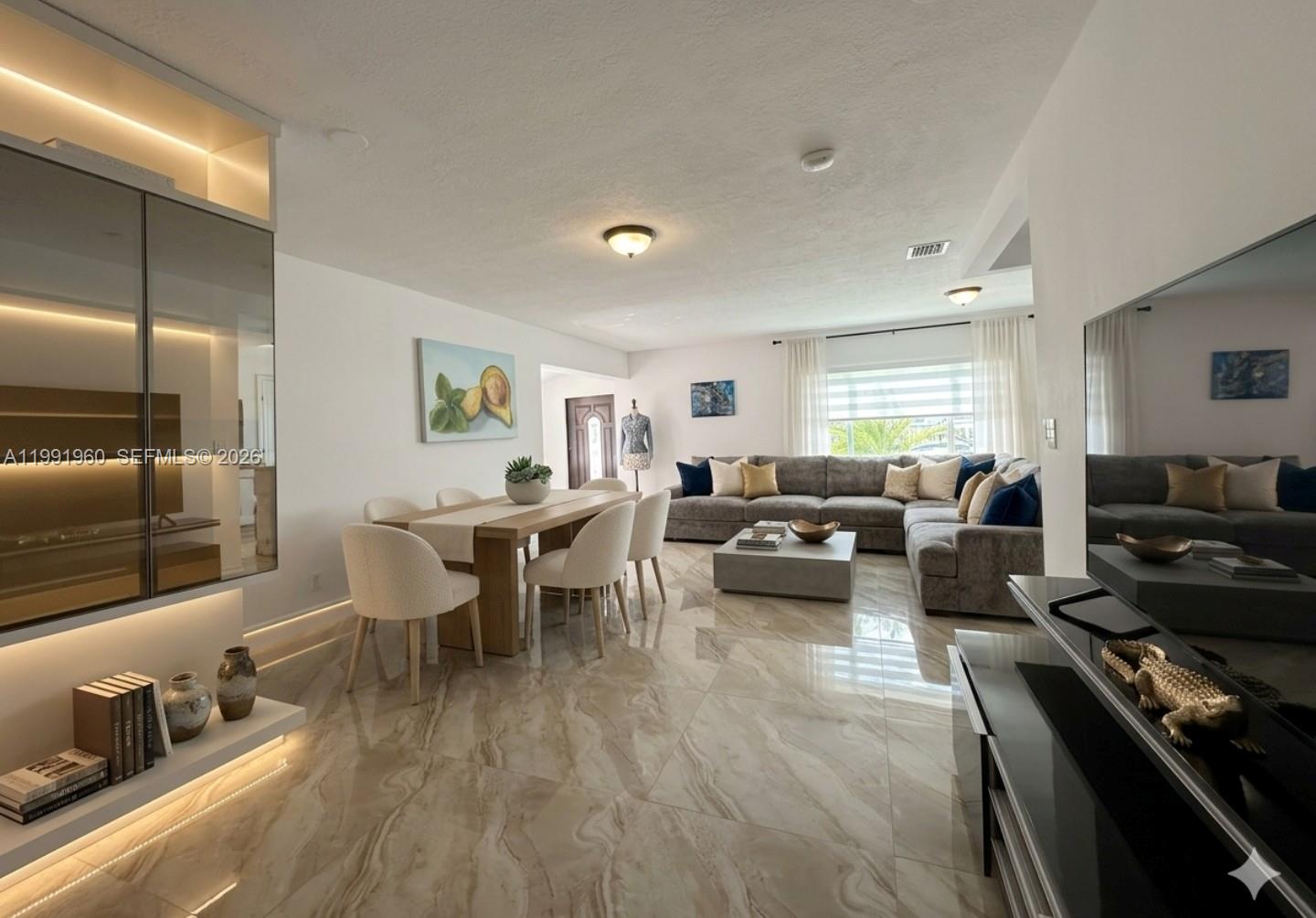 625 East 8th Lane Hialeah, FL 33010 - Photo 14 of 46 a living room with furniture and wooden floor