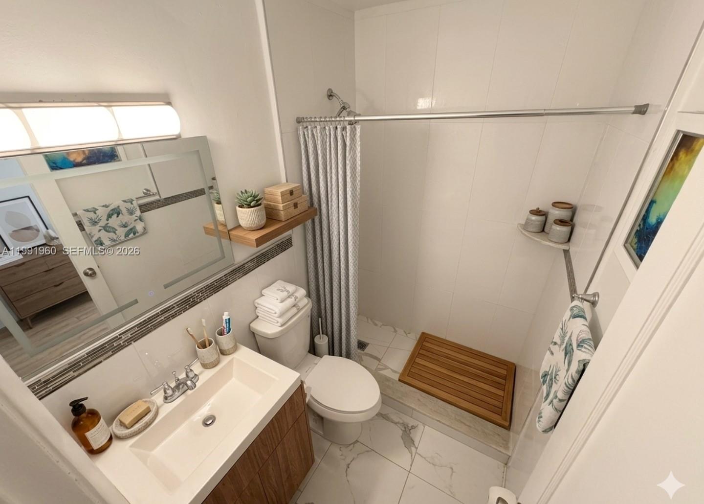 625 East 8th Lane Hialeah, FL 33010 - Photo 16 of 46 a bathroom with a sink toilet and shower
