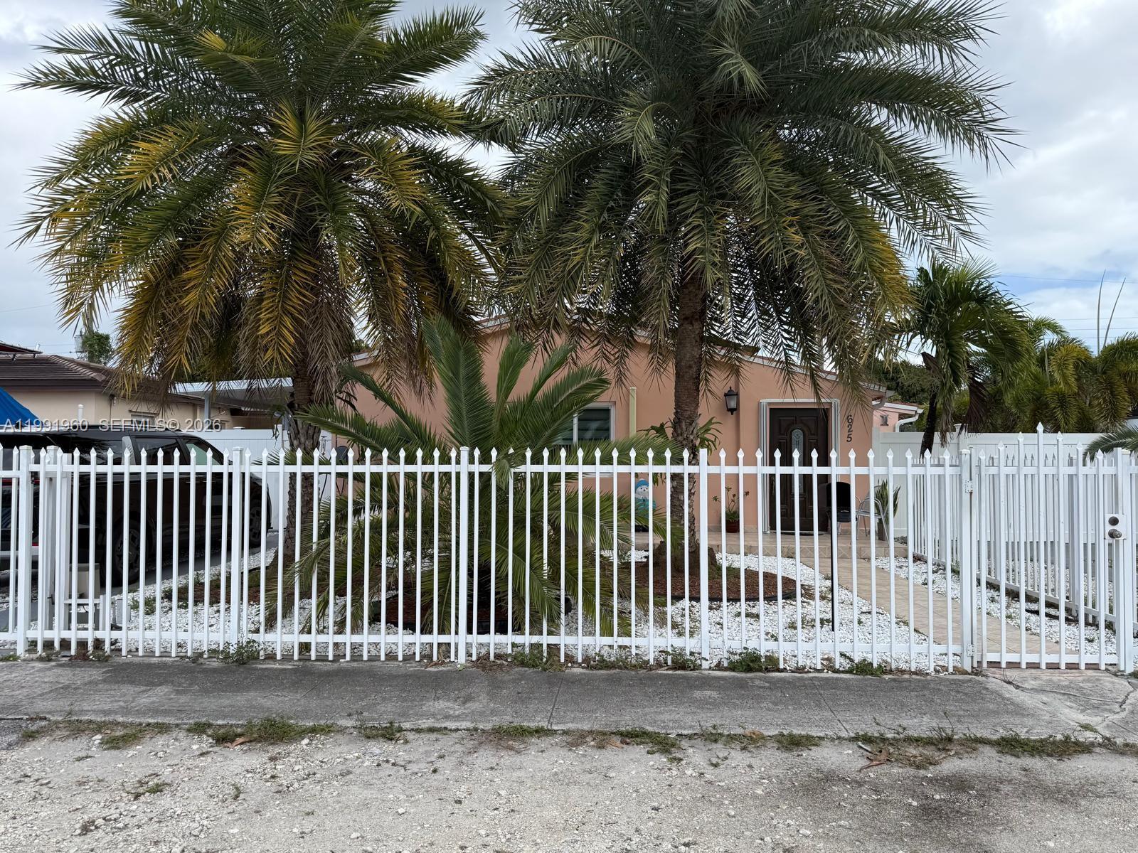 625 East 8th Lane Hialeah, FL 33010 - Photo 2 of 46 a view of a house with a small yard