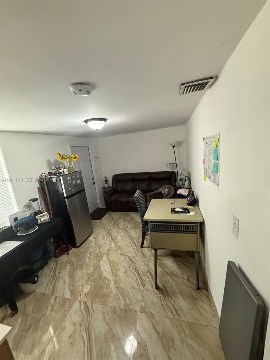 625 East 8th Lane Hialeah, FL 33010 - Photo 29 of 46 a living room with furniture