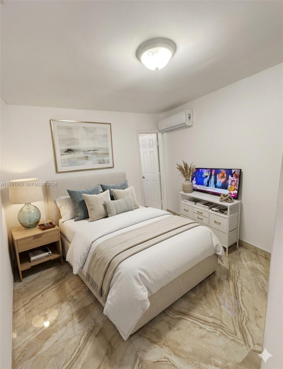 625 East 8th Lane Hialeah, FL 33010 - Photo 30 of 46 a bedroom with a bed and a painting on the wall