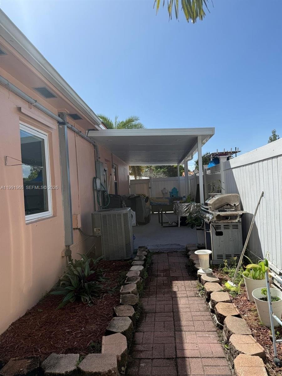 625 East 8th Lane Hialeah, FL 33010 - Photo 39 of 46 a view of a backyard with sitting area